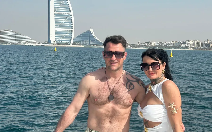 A private yacht off the Dubai coast with the skyline behind it