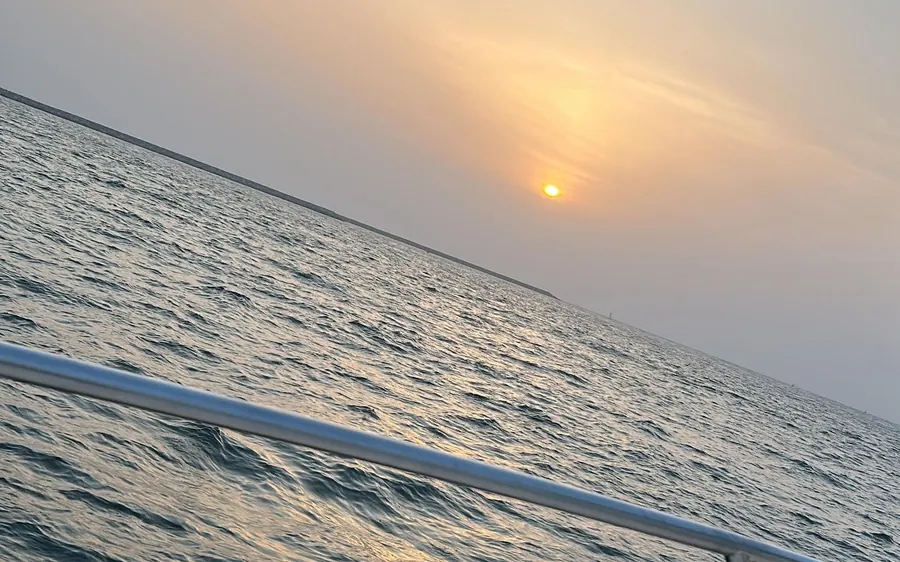 The Dubai skyline at sunset from a private yacht
