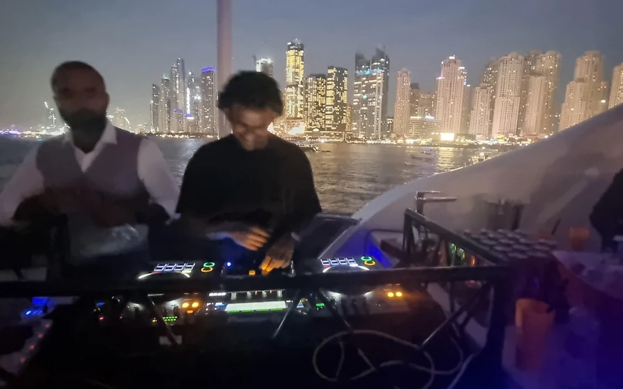 A superyacht cruising through Dubai Harbour